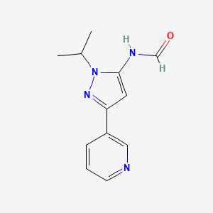 molecular formula C12H14N4O B13883451 N-(2-propan-2-yl-5-pyridin-3-ylpyrazol-3-yl)formamide 