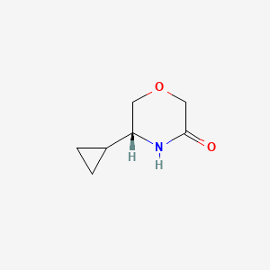 molecular formula C7H11NO2 B13915354 (5R)-5-Cyclopropylmorpholin-3-one 