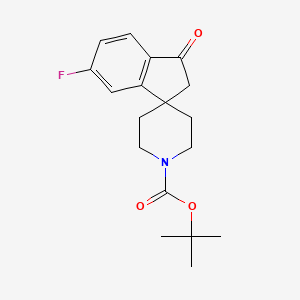 molecular formula C18H22FNO3 B1391862 Tert-butyl 6-fluoro-3-oxo-2,3-dihydrospiro[indene-1,4'-piperidine]-1'-carboxylate CAS No. 910442-55-6