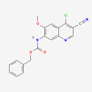 molecular formula C19H14ClN3O3 B13918782 Carbamic acid, (4-chloro-3-cyano-6-methoxy-7-quinolinyl)-, phenylmethyl ester (9CI) 