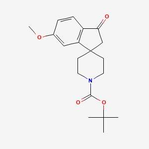 molecular formula C19H25NO4 B1391889 Tert-butyl 6-methoxy-3-oxo-2,3-dihydrospiro[indene-1,4'-piperidine]-1'-carboxylate CAS No. 910442-59-0
