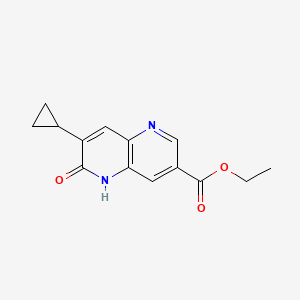 molecular formula C14H14N2O3 B13922631 Ethyl 7-cyclopropyl-5,6-dihydro-6-oxo-1,5-naphthyridine-3-carboxylate 