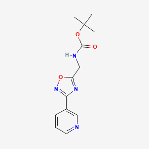 molecular formula C13H16N4O3 B1393015 tert-butyl N-{[3-(pyridin-3-yl)-1,2,4-oxadiazol-5-yl]methyl}carbamate CAS No. 1053656-62-4