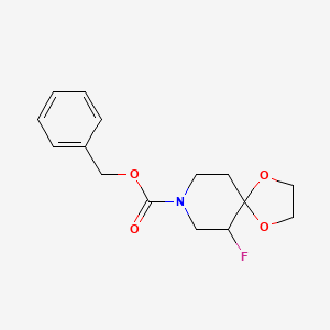 molecular formula C15H18FNO4 B13932800 Benzyl 6-fluoro-1,4-dioxa-8-azaspiro[4.5]decane-8-carboxylate 