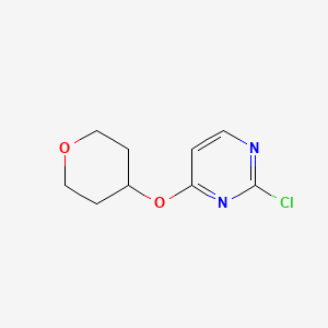 B1394327 2-Chloro-4-(tetrahydro-2H-pyran-4-yloxy)pyrimidine CAS No. 1216402-53-7