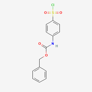 molecular formula C14H12ClNO4S B13958064 Benzyl [4-(chlorosulfonyl)phenyl]carbamate 