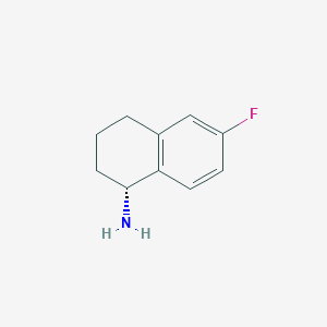 molecular formula C10H12FN B1396091 (1R)-6-Fluoro-1,2,3,4-tetrahydronaphthalen-1-amine CAS No. 1057246-78-2