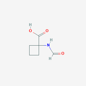 molecular formula C6H9NO3 B13967678 1-Formamidocyclobutane-1-carboxylic acid CAS No. 777803-50-6