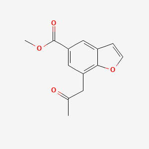 molecular formula C13H12O4 B13978006 Methyl 7-(2-oxopropyl)-5-benzofurancarboxylate CAS No. 286836-80-4