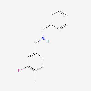 molecular formula C15H16FN B1398105 Benzyl[(3-fluoro-4-methylphenyl)methyl]amine CAS No. 1183301-35-0