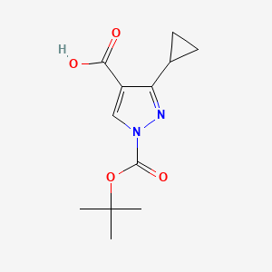 molecular formula C12H16N2O4 B13986285 3-Cyclopropyl-1-{[(1,1-dimethylethyl)oxy]carbonyl}-1H-pyrazole-4-carboxylic acid 