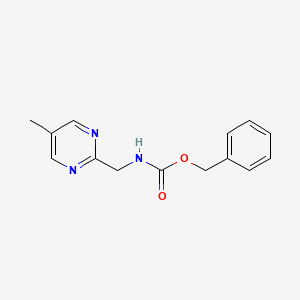 molecular formula C14H15N3O2 B13994875 Phenylmethyl N-[(5-methyl-2-pyrimidinyl)methyl]carbamate CAS No. 930272-57-4