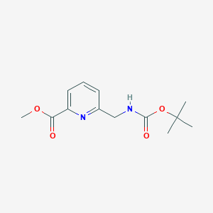 molecular formula C13H18N2O4 B14001973 Methyl 6-({[(tert-butoxy)carbonyl]amino}methyl)pyridine-2-carboxylate 