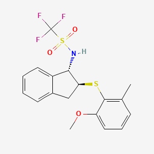 molecular formula C18H18F3NO3S2 B14012618 N-[(1S,2S)-2,3-Dihydro-2-[(2-methoxy-6-methylphenyl)thio]-1H-inden-1-yl]-1,1,1-trifluoromethanesulfonamide 