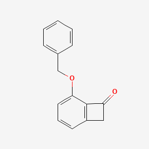 molecular formula C15H12O2 B14015743 5-(Benzyloxy)bicyclo[4.2.0]octa-1,3,5-trien-7-one 