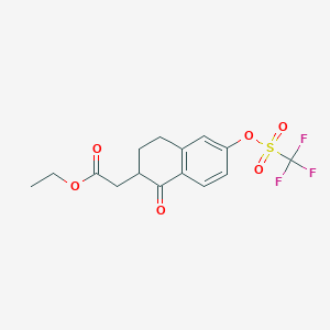 molecular formula C15H15F3O6S B14030807 Ethyl 2-(1-oxo-6-(((trifluoromethyl)sulfonyl)oxy)-1,2,3,4-tetrahydronaphthalen-2-yl)acetate 