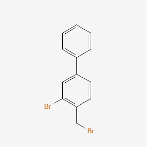 molecular formula C13H10Br2 B1403408 3-Bromo-4-(bromomethyl)-1,1'-biphenyl CAS No. 1396865-04-5