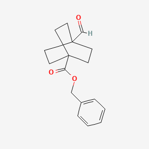 molecular formula C17H20O3 B1405478 苯甲基 4-甲酰基双环[2.2.2]辛烷-1-羧酸酯 CAS No. 340023-13-4
