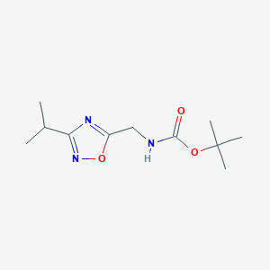 molecular formula C11H19N3O3 B1407005 (3-Isopropyl-[1,2,4]oxadiazol-5-ylmethyl)-carbamic acid tert-butyl ester CAS No. 1431555-29-1
