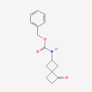 molecular formula C15H17NO3 B14090625 benzyl N-(7-oxospiro[3.3]heptan-2-yl)carbamate 