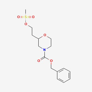 molecular formula C15H21NO6S B1409469 Benzyl 2-(2-((methylsulfonyl)oxy)-ethyl)morpholine-4-carboxylate CAS No. 1648864-39-4