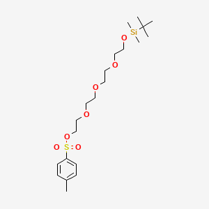 B1412421 Toluene-4-sulfonic acid 2-(2-{2-[2-(tert-butyl-dimethyl-silanyloxy)-ethoxy]-ethoxy}-ethoxy)-ethyl ester CAS No. 571167-64-1