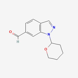 molecular formula C13H14N2O2 B1412801 1-(Tetrahydro-2H-pyran-2-yl)-1H-indazole-6-carboxaldehyde CAS No. 1337880-03-1