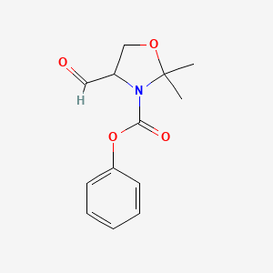 molecular formula C13H15NO4 B14182676 Phenyl 4-formyl-2,2-dimethyl-1,3-oxazolidine-3-carboxylate CAS No. 921766-31-6
