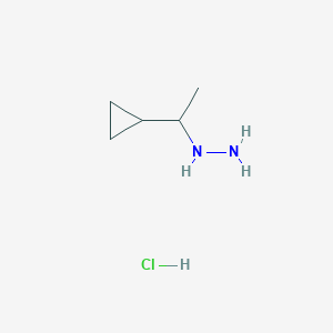 molecular formula C5H13ClN2 B1420230 (1-Cyclopropylethyl)hydrazine hydrochloride CAS No. 1181458-68-3