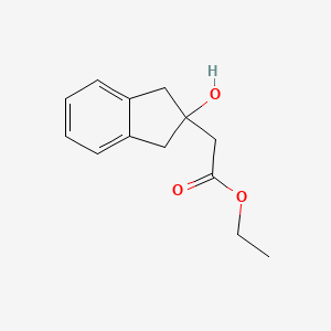 molecular formula C13H16O3 B1422889 ethyl 2-(2-hydroxy-2,3-dihydro-1H-inden-2-yl)acetate CAS No. 57932-04-4