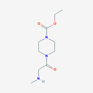 molecular formula C10H19N3O3 B1425342 Ethyl 4-[2-(methylamino)acetyl]piperazine-1-carboxylate CAS No. 1073555-07-3