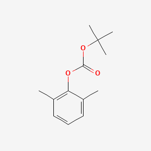 molecular formula C13H18O3 B14253788 Carbonic acid, 1,1-dimethylethyl 2,6-dimethylphenyl ester CAS No. 206662-73-9