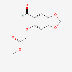 molecular formula C12H12O6 B1425574 ethyl 2-[(6-formyl-2H-1,3-benzodioxol-5-yl)oxy]acetate CAS No. 13668-86-5