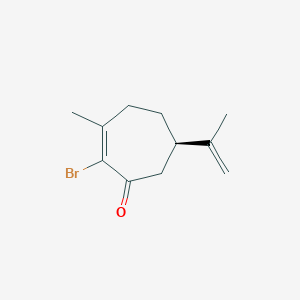 molecular formula C11H15BrO B14255835 (6R)-2-Bromo-3-methyl-6-(prop-1-en-2-yl)cyclohept-2-en-1-one CAS No. 322000-37-3