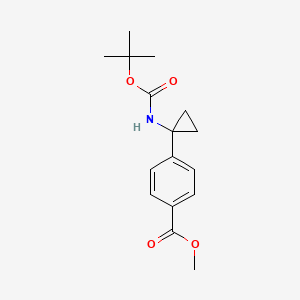 molecular formula C16H21NO4 B1427283 Methyl 4-(1-{[(tert-butoxy)carbonyl]amino}cyclopropyl)benzoate CAS No. 1338243-88-1