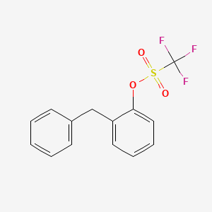 molecular formula C14H11F3O3S B14278269 Methanesulfonic acid, trifluoro-, 2-(phenylmethyl)phenyl ester CAS No. 166959-36-0