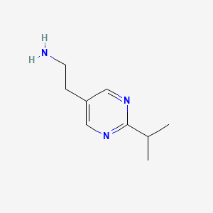 molecular formula C9H15N3 B1428848 2-[2-(Propan-2-yl)pyrimidin-5-yl]ethan-1-amine CAS No. 944905-69-5