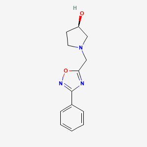 molecular formula C13H15N3O2 B1431777 (3R)-1-[(3-phenyl-1,2,4-oxadiazol-5-yl)methyl]pyrrolidin-3-ol CAS No. 1423040-64-5