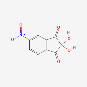 molecular formula C9H5NO6 B14333811 2,2-Dihydroxy-5-nitroindene-1,3-dione CAS No. 106483-66-3