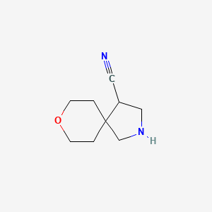 B1434455 8-Oxa-2-azaspiro[4.5]decane-4-carbonitrile CAS No. 1935541-10-8