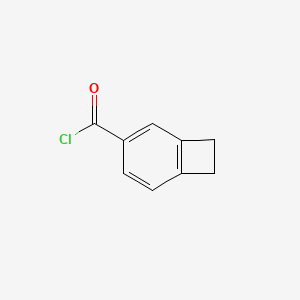 molecular formula C9H7ClO B14350629 Bicyclo[4.2.0]octa-1,3,5-triene-3-carbonyl chloride CAS No. 99718-03-3