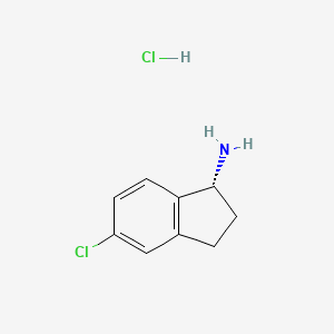 molecular formula C9H11Cl2N B1435612 (R)-5-Chloro-2,3-dihydro-1H-inden-1-amine hydrochloride CAS No. 1637453-67-8