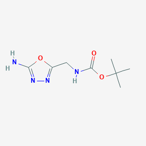 molecular formula C8H14N4O3 B1436007 tert-Butyl N-[(5-amino-1,3,4-oxadiazol-2-yl)methyl]carbamate CAS No. 942034-89-1