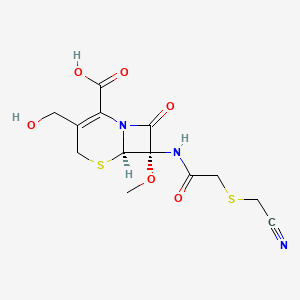 molecular formula C13H15N3O6S2 B1436017 (6R,7S)-7-(2-(cyanomethylthio)acetamido)-3-(hydroxymethyl)-7-methoxy-8-oxo-5-thia-1-azabicyclo[4.2.0]oct-2-ene-2-carboxylic acid CAS No. 70953-19-4