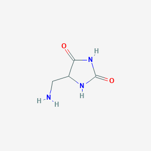 molecular formula C4H7N3O2 B143607 5-(Aminomethyl)imidazolidine-2,4-dione CAS No. 137350-53-9