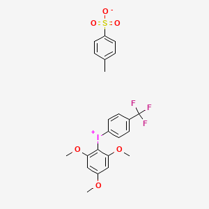 molecular formula C23H22F3IO6S B1436104 [(4-Trifluoromethyl)phenyl](2,4,6-trimethoxyphenyl)iodonium p-toluenesulfonate CAS No. 1868173-15-2