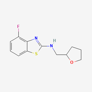 4-fluoro-N-(tetrahydrofuran-2-ylmethyl)-1,3-benzothiazol-2-amine