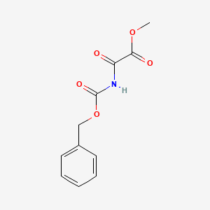 molecular formula C11H11NO5 B14414013 Methyl {[(benzyloxy)carbonyl]amino}(oxo)acetate CAS No. 84449-08-1
