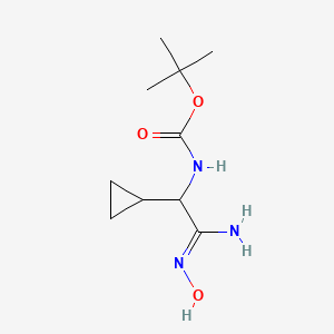 molecular formula C10H19N3O3 B1443029 tert-butyl N-[cyclopropyl(N'-hydroxycarbamimidoyl)methyl]carbamate CAS No. 1306615-55-3