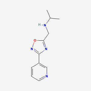 molecular formula C11H14N4O B1443378 N-((3-(pyridin-3-yl)-1,2,4-oxadiazol-5-yl)methyl)propan-2-amine CAS No. 1184229-50-2